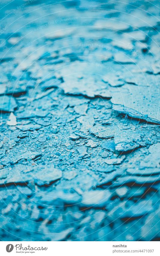 Abstract texture of cracked blue paint grunge rubble background abstract debris wreckage dry rough tones monochrome duotone cool cold freeze frozen break broken