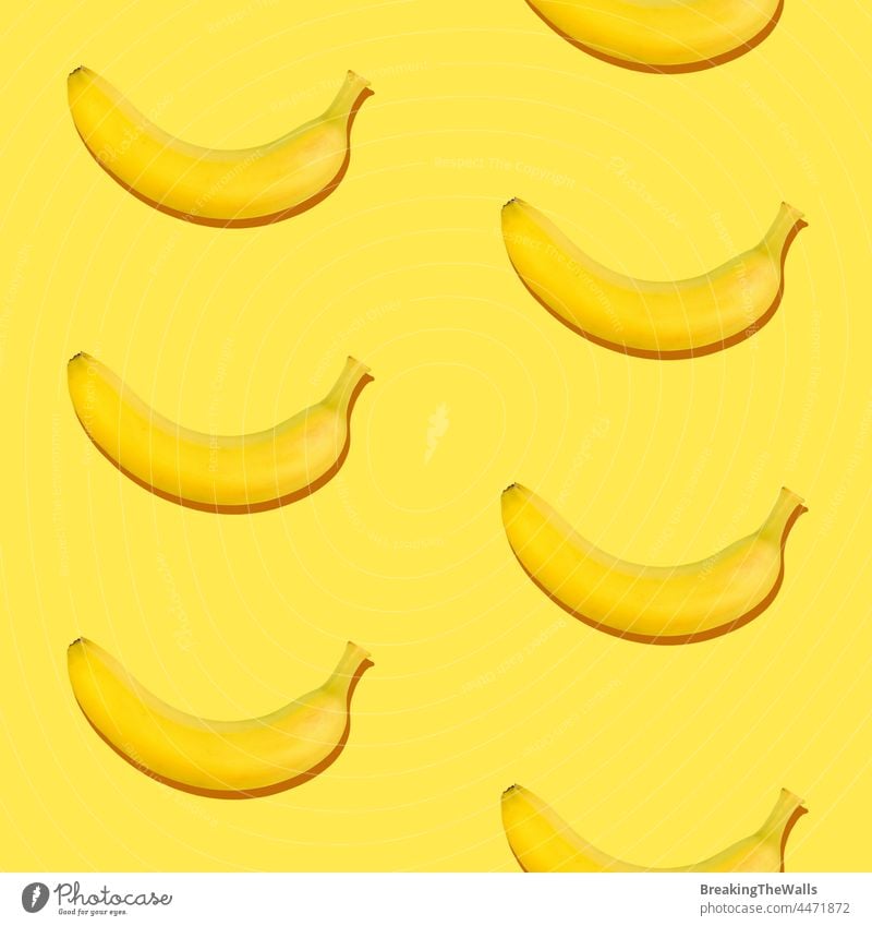 Seamless pattern of bananas on yellow background Banana seamless fruit tropical healthy eating vitamin season freshness ripe color vivid vegetarian repetition
