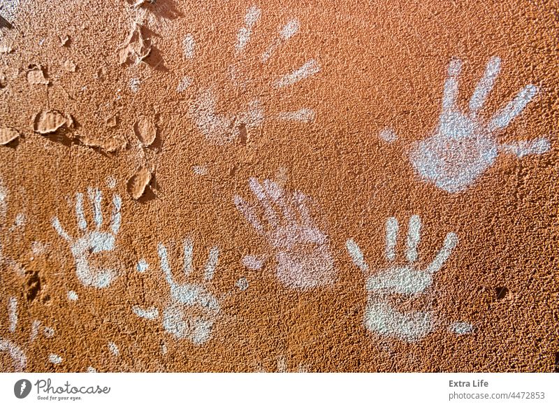 Multiple colorful children hand prints on huskily brown wall Abstract Art Artistic Background Brown Chalk Child Childhood Color Colored Colorful Creativity