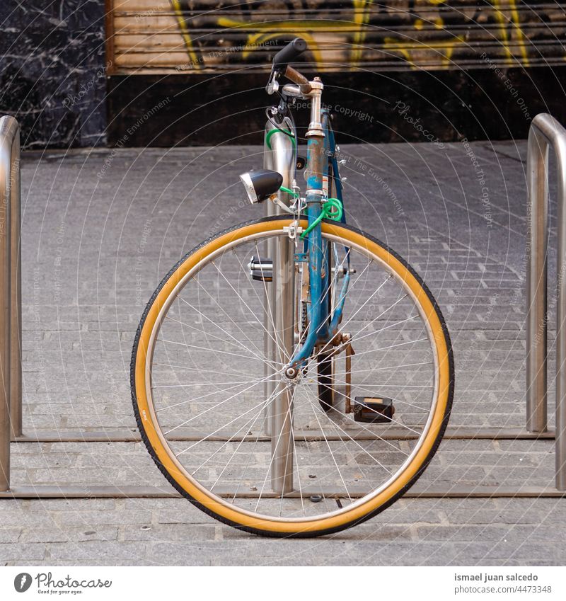 blue bicycle on the street mode of transportation bike cycling biking seat wheel handlebar object hobby lifestyle outdoors