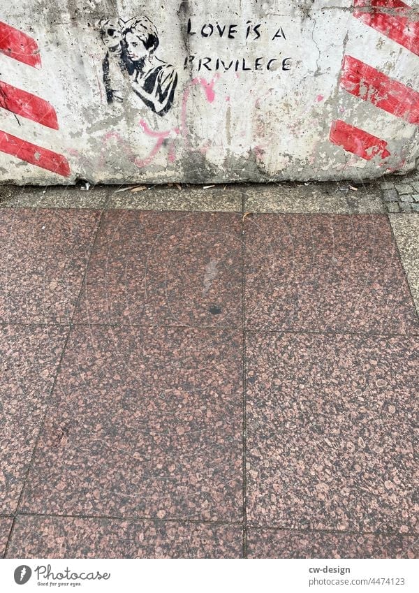 LOVE IS A PRIVILEGE - drawn & painted Love Woman street art Berlin Concrete esteem Red White Gray off walkway slabs pavement damages Signs and labeling Deserted