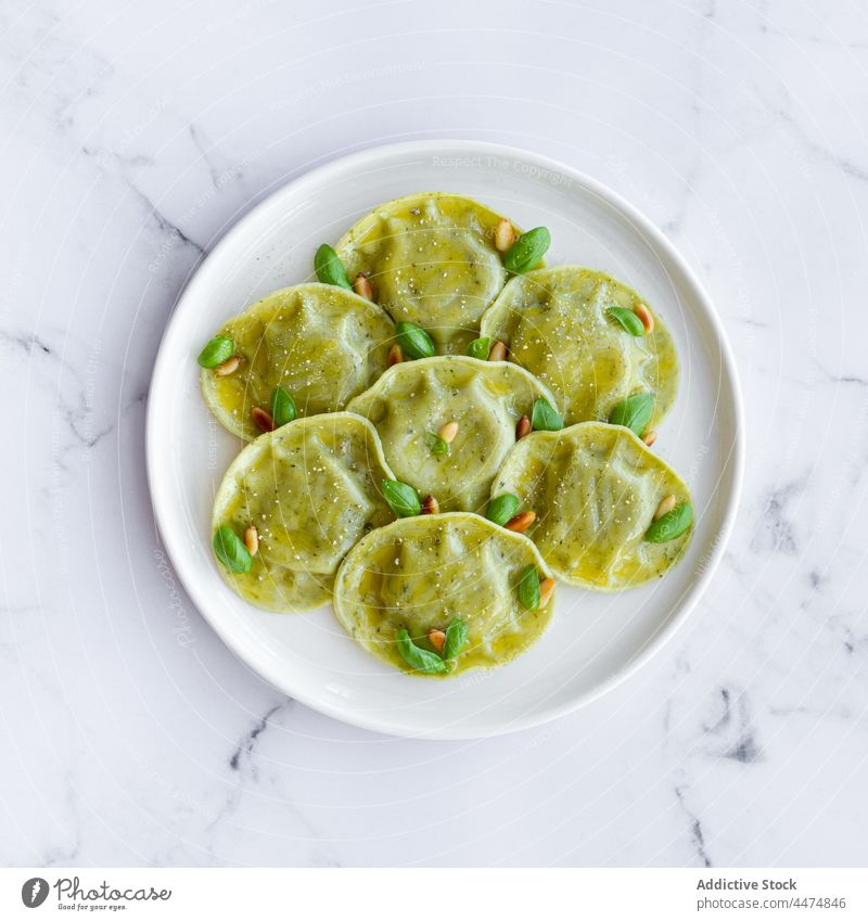 Delicious raviolis on marble table serve food meal basil pasta dough dish cuisine italian plate delicious tasty decor palatable edible portion pine nut kitchen