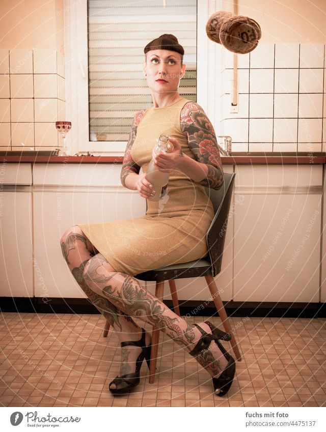 Wife pops corks Tattooed Woman Cork To pop the corks Party mood Bottle Drinking Feasts & Celebrations Sparkling wine Beverage Alcoholic drinks Dress Legs Bangs