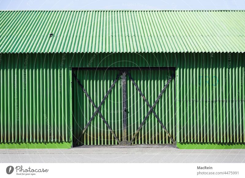 Green corrugated iron hall Manmade structures Architecture Hall Gate entrance nobody no man Exterior shot Corrugated sheet iron corrugated iron hut