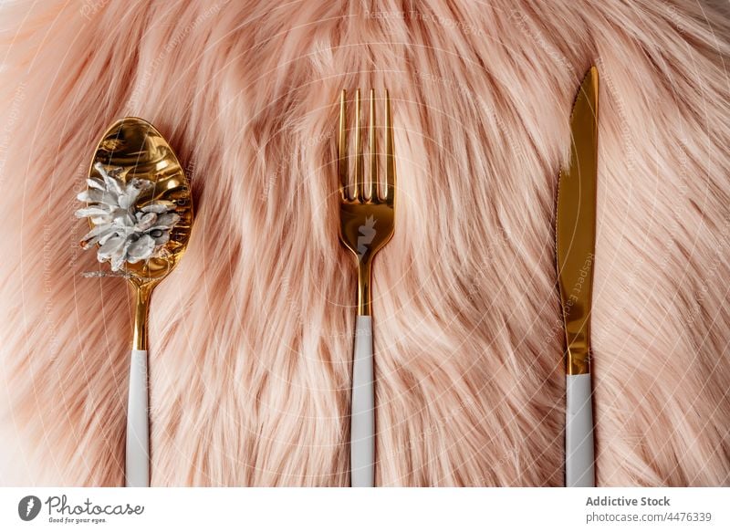 Pink christmas table setting with white and gold cutlery decoration pink placemat fluffy celebration thanksgiving holiday cute fork dinner festive knife xmas
