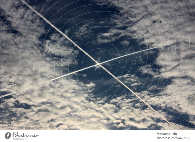 Contrails crossing in the sky Vapor trail Node flight Airplane Aircraft Aviation Flying Clouds encounter Airlines air traffic no flying Freedom