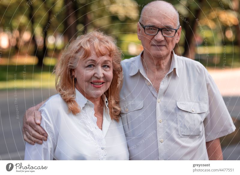 Happy senior family couple outdoor portrait retired old people family bonds mature person glasses street woman wife husband happy cheerful elderly bonding city