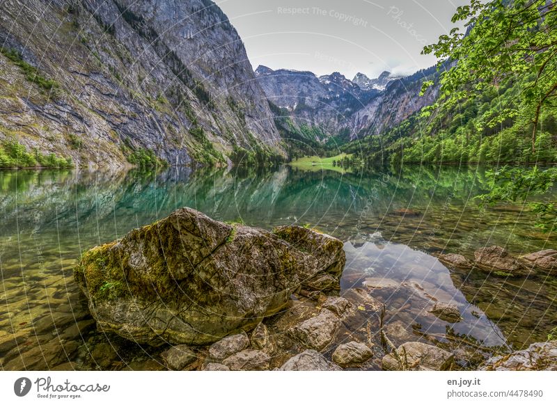 big rock in mountain lake with reflection in green environment Lake Lake Obersee Köngissee Rock mountains Water Green Turkey voyage Vacation mood Reflection