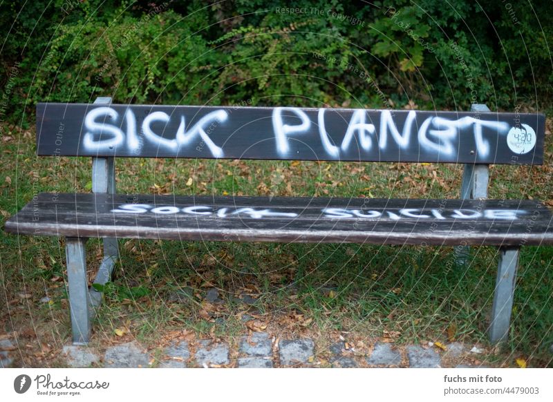 Sick Planet, graffiti on a bench Graffiti Bench seat Remark Colour photo Deserted Word lettering Park bench Letters (alphabet) Text Social