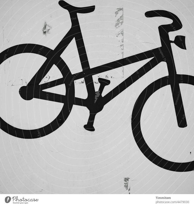 Parking space for bicycles Bicycle Pictogram Means of transport Transport safekeeping Mobility Deserted Parking area Black & white photo Surface polluted