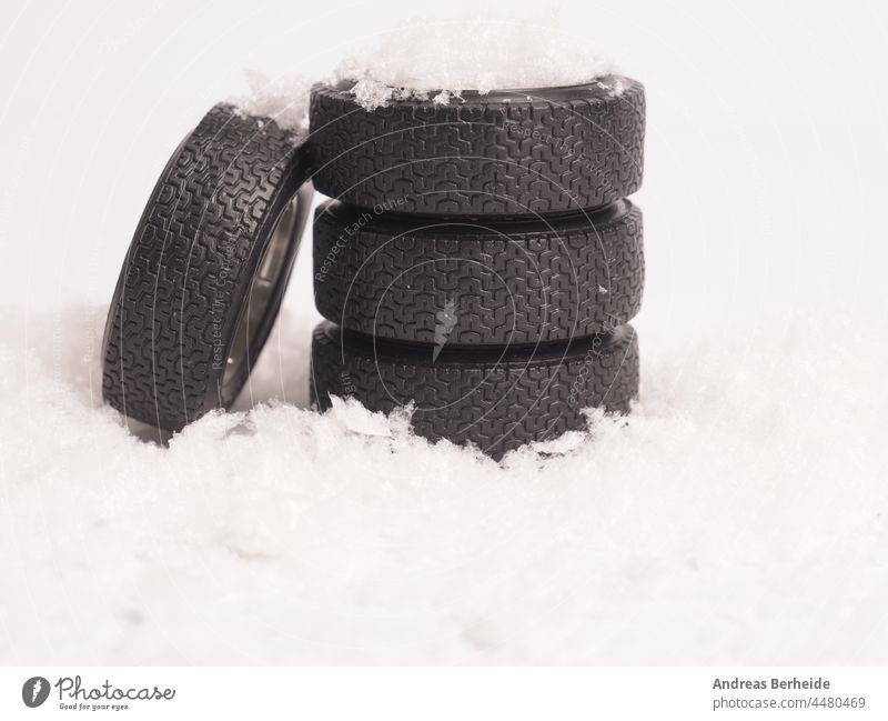 Winter tires stacked in the snow, winter season concept freeze freezing safety insurance spare snowfall duty road security weather snowflake transport slippery