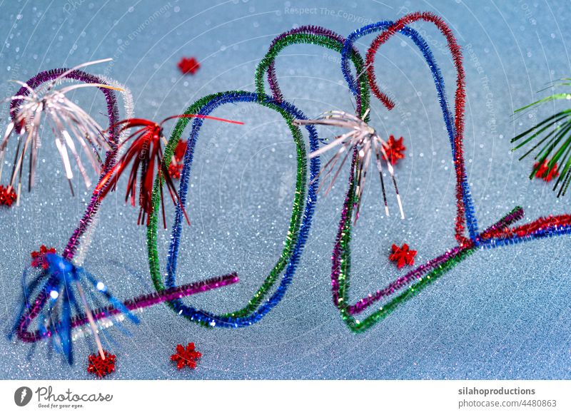 2022 New Years postcard with festive multicolored pipe cleaners. turquoise calendar month new year date celebration colors blue number writing season surface