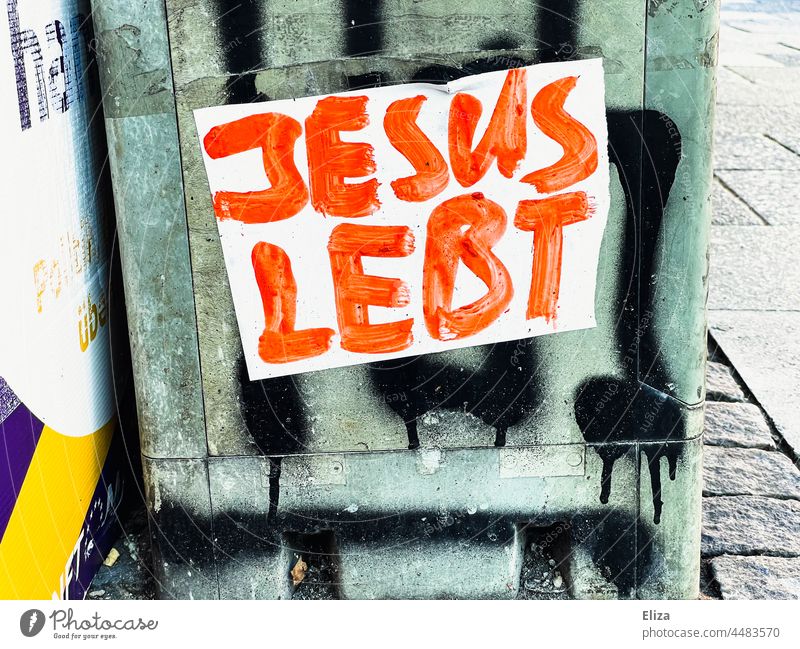 Sticker with the inscription "Jesus lives" in red letters on a power box. Christianity and religion. Religion and faith Jesus Christ Belief Hope believe Holy