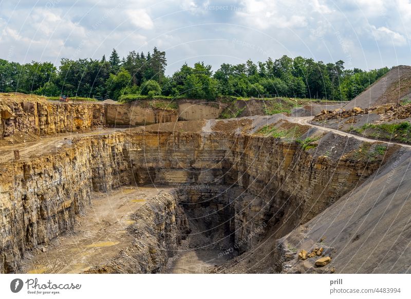 Stone quarry stone quarry mining open-pit mine gravel rock rock face digging limestone hole germany southern germany hohenlohe summer sunny industry