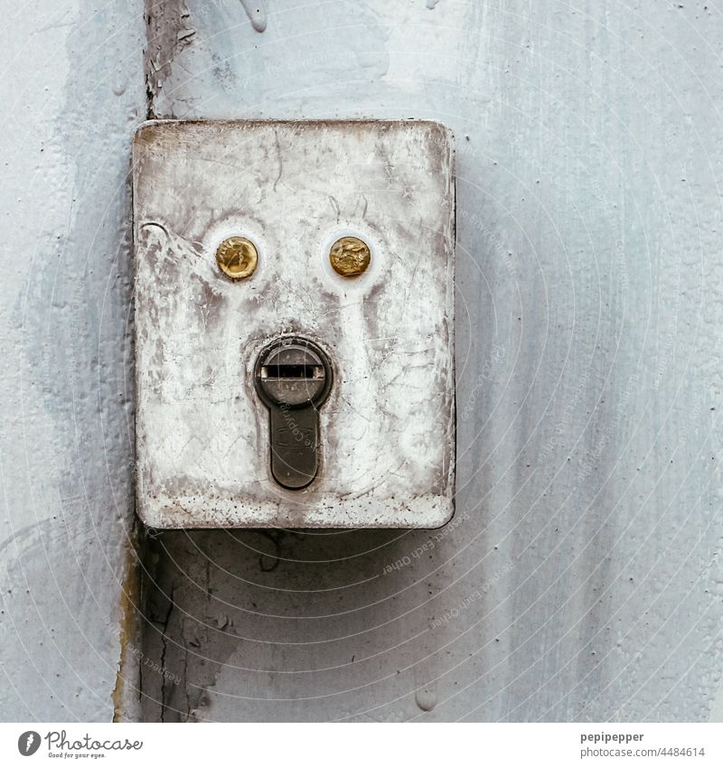 Urban Faces - old electrical box with lock urban faces Facial expression object Object with face eyes Junction box Lock visually Eyes Mouth no man human