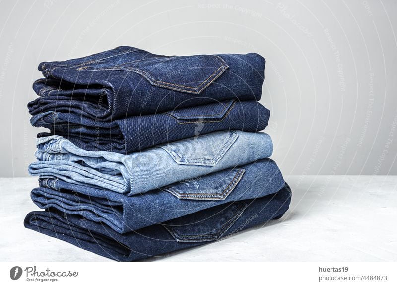 Blue jeans pants clothes pile background blue jeans White denim garments fabric fashion style clothing design casual texture trousers textile cotton wear pocket