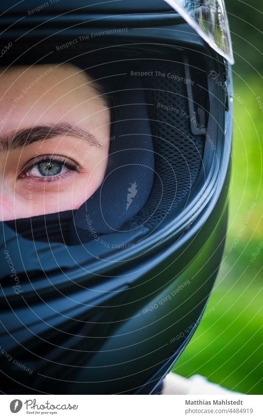 Young woman with motorcycle helmet Motorcycle Speed Human being Exterior shot Transport Freedom Motorcyclist Adventure Engines Bikers Street Eyes Eyebrow
