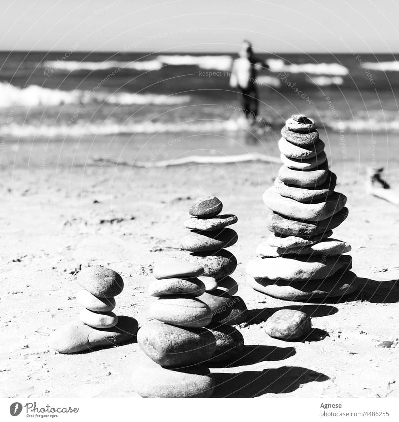 Stone Tower and Sea stones SEA Beach stone tower Meditation landart Swimming swimmer Boy (child) rocks Rock Water Black & white photo Nature Balance harmony