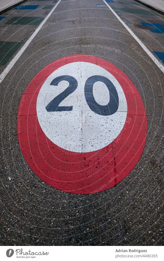 Speed limit sign painted on the road circles direction drive information law lines number path round safety slow speed traffic transport transportation warning