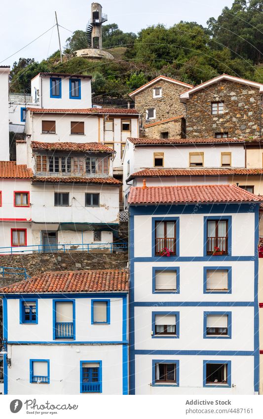 Typical residential houses in Spain building typical weathered old fashioned shabby obsolete facade tree spain asturias construction dwell exterior town street
