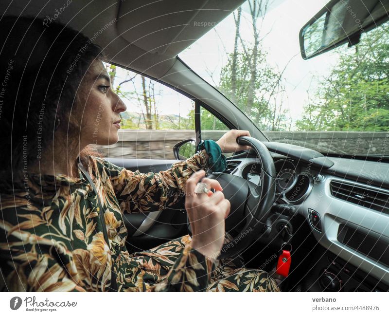 caucasian young woman driving a car in autumn travel sitting vehicle transportation people journey driver automobile road beautiful lifestyle trip happiness