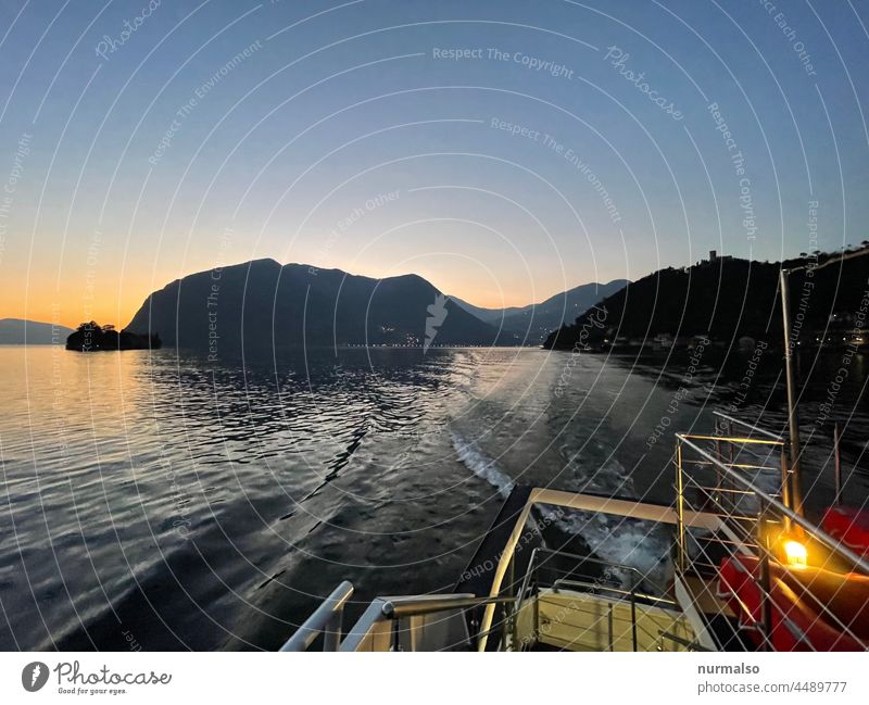 Postcard from Italy Lake Alps isola Ferry ship evening mood marine freshwater Sunset Lifeboat vacation To enjoy alpine lake mountains Freedom