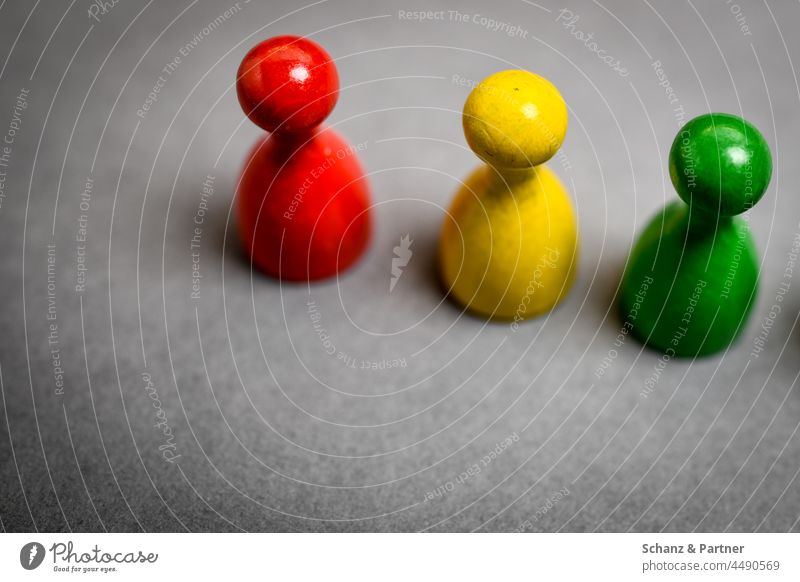 three game pieces, red, yellow and green Board game Playing SPD Free Democratic Party Coalition the green ones Green Piece little man Wooden figure policy