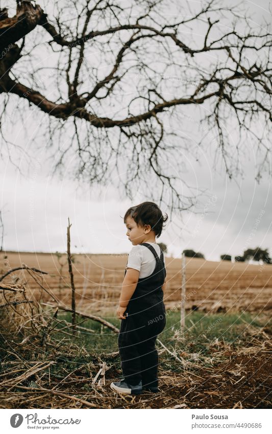 Child standing on the fields Caucasian 1 - 3 years one person Day Happy Infancy Cute Lifestyle Exterior shot Joy Human being Colour photo thinking explore