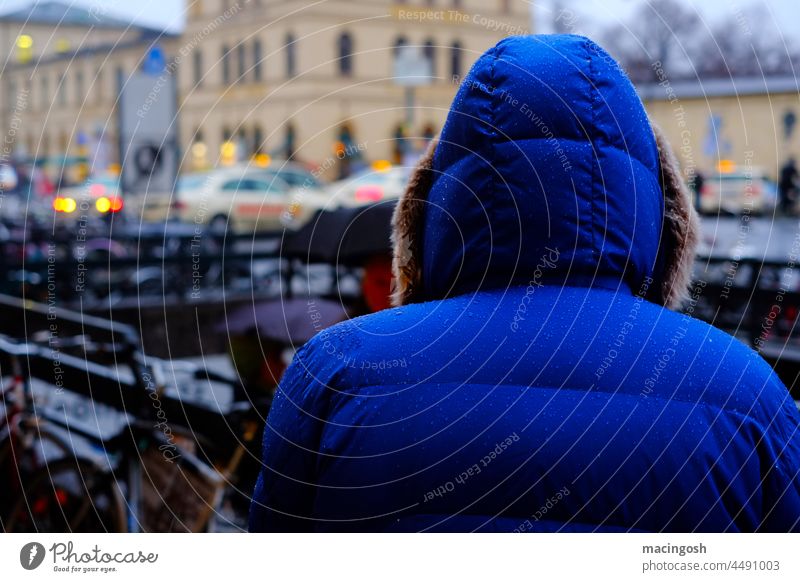 Anonymous in the big city Human being Man Woman Lonely Loneliness sad Autumn Bad weather Rain Exterior shot Wet Sadness Blue Hooded jacket winter jacket