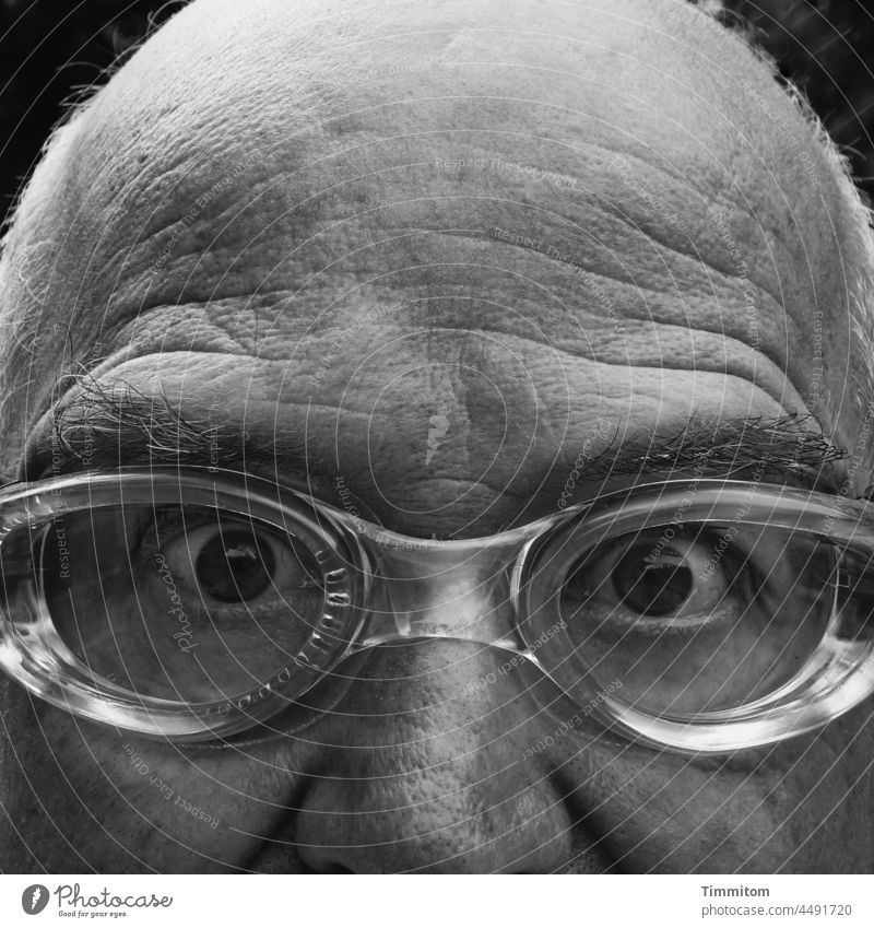 Old man - in search of... Man Head Forehead crease Nose eyes Swimming goggles Looking Wacky Face Human being Black & white photo Gaze