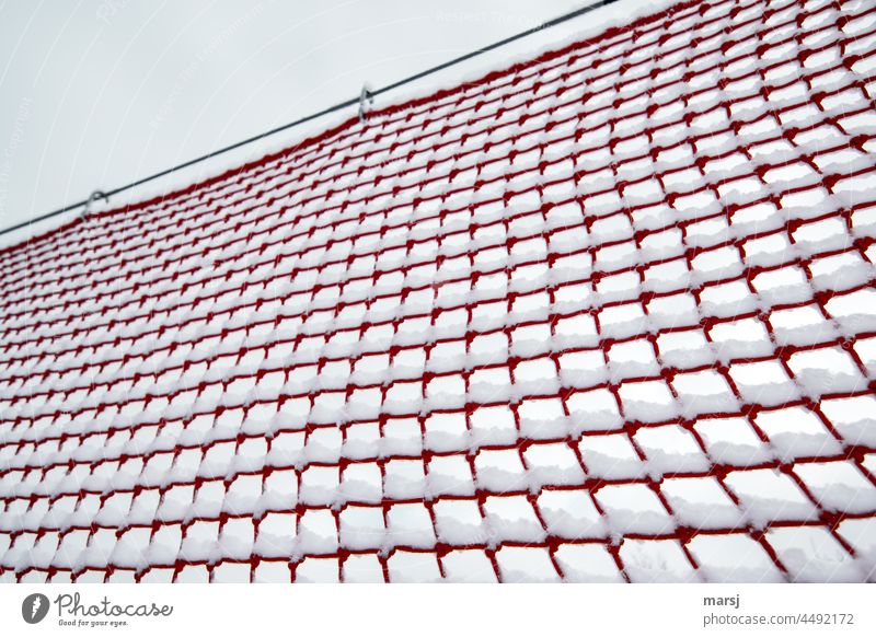 Safety net in red. Decorated with fresh snow. safety net safety precaution Red Net Slope safety Structures and shapes Network