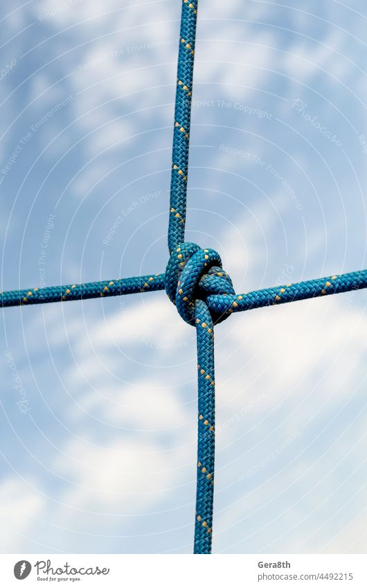lots of ropes and a big knot against the blue sky abstract associate background bend blank blue sky sky bundle climbing close closeup color combination