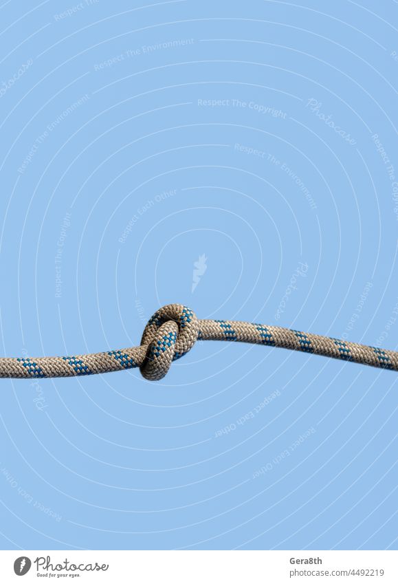 lots of ropes and a big knot against the blue sky abstract associate background bend blank blue sky sky bundle climbing close closeup color combination