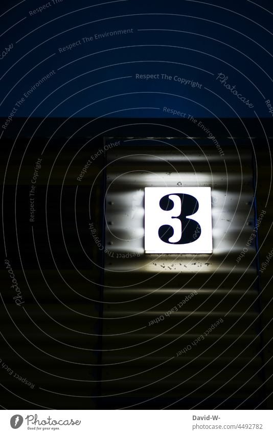 No. 3 - Number three as sign / house number shining at night House number digit Digits and numbers luminescent