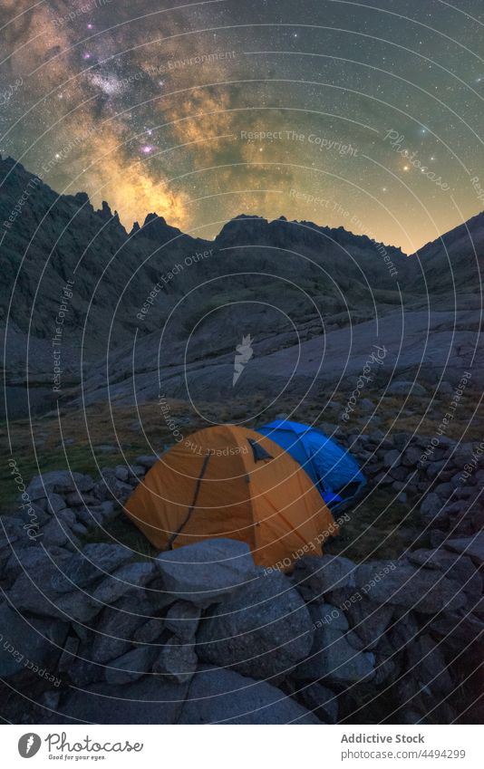 Tent in river against mount under starry sky mountain nature highland landscape galaxy universe tent milky way evening sierra de gredos ridge lake