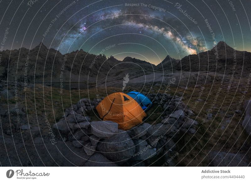 Tent in river against mount under starry sky mountain nature highland landscape galaxy universe tent milky way evening sierra de gredos ridge lake