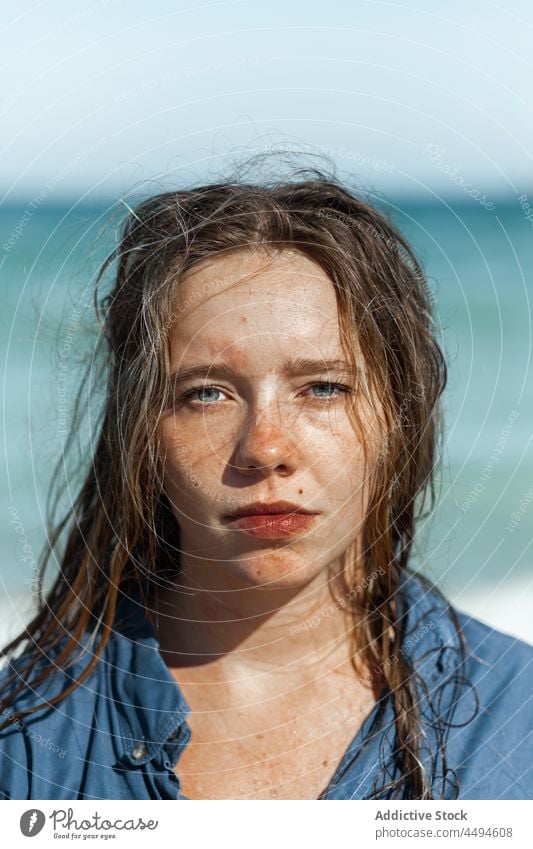 Woman in wet shirt standing on beach woman sea summer sand water nature sit coast shore female relax seashore portrait enjoy seaside young peaceful calm