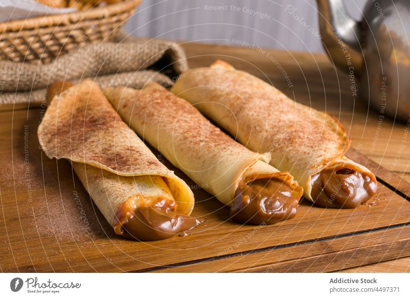 Crepes with dulce de leche filling crepe sweet dessert treat culinary homemade roll indulge food tasty cuisine serve delicious kitchen appetizing yummy fresh