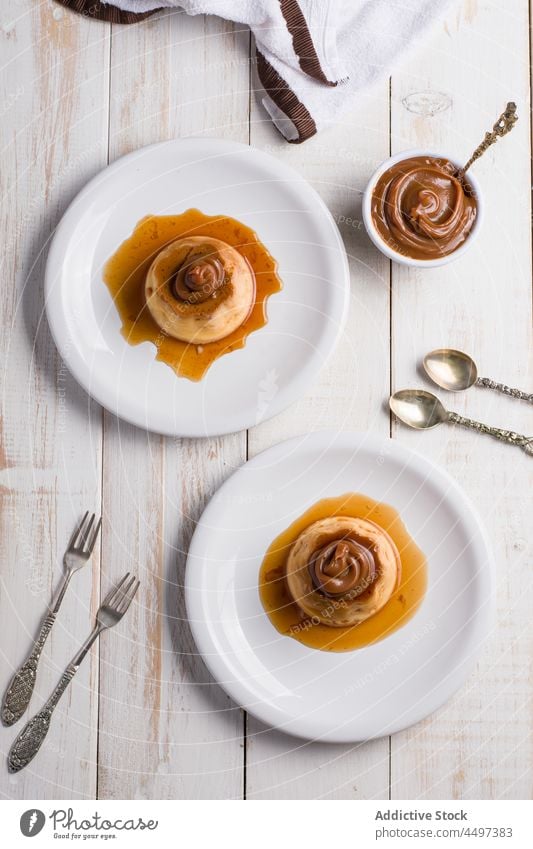 Egg custards with Dulce de leche egg dessert sweet dulce de leche caramel sauce serve food culinary confectionery topping portion kitchen cutlery syrup plate