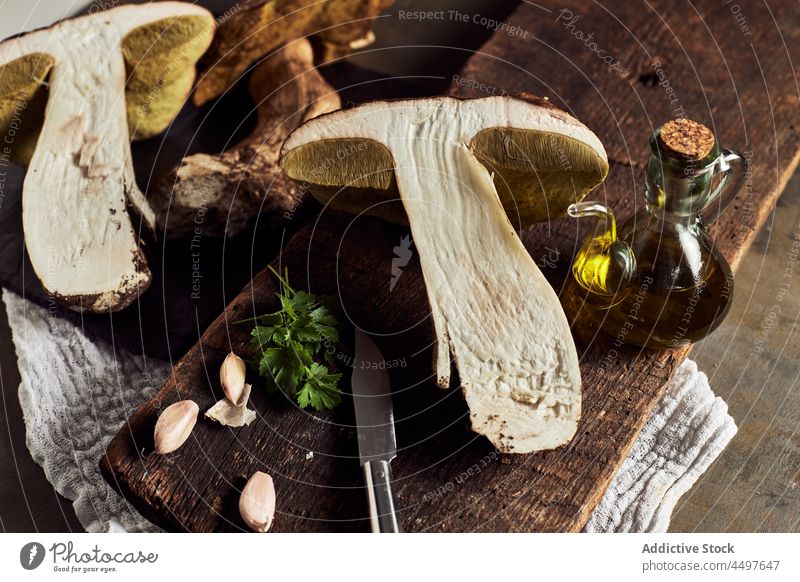 Boletus edulis on cutting board boletus edulis mushroom raw fungus cook specie organic food culinary natural edible yummy delicious cap stem fresh product