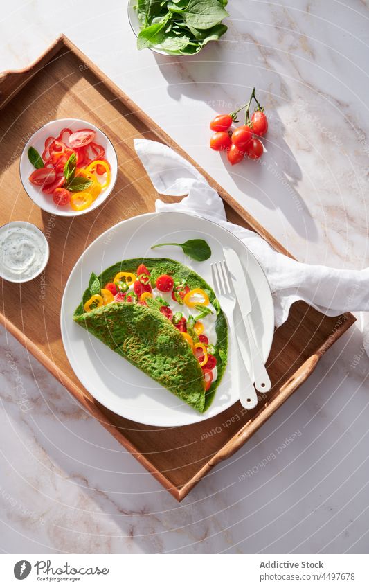 Spinach creppe with vegetables and sour cream spinach tomato pepper lunch tray salad leaf food organic vegetarian gourmet meal dinner delicious healthy food