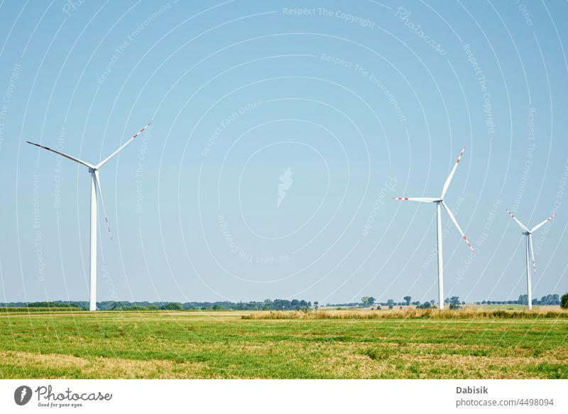 Wind turbine generator in the field renewable energy green energy windmill wind turbine eco ecology agriculture alternative background blade clean concept