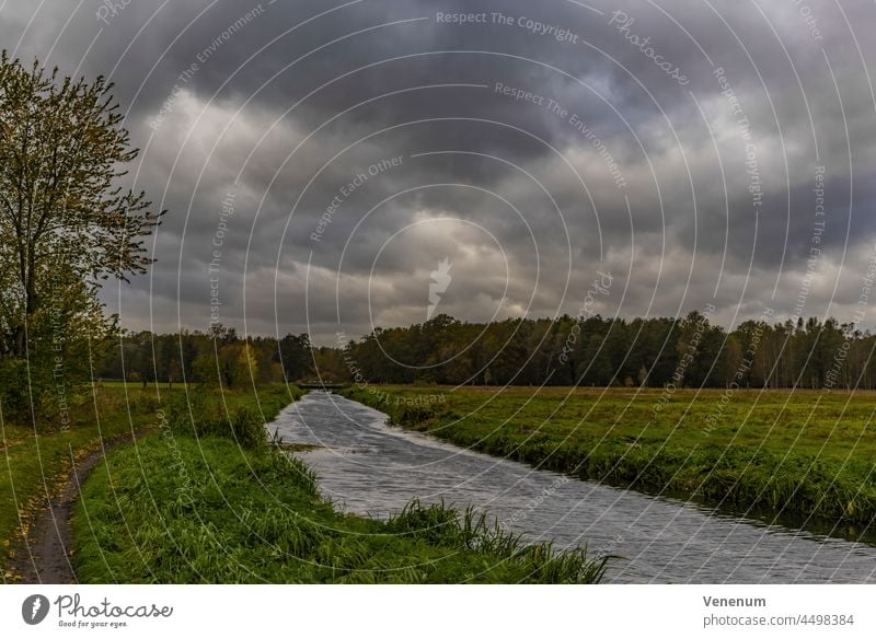 Sturm Hendrik,many clouds in the sky over a meadow with a river during the storm Rivers water waters water reflections forest forests branch branches green lung