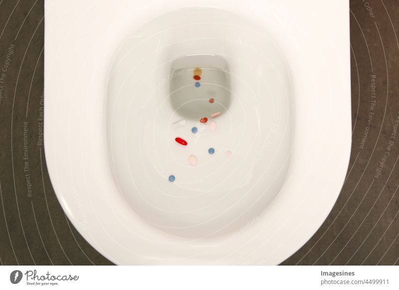 Pollution. Disposing of medicines in the toilet. Medicine, pills, capsules and tablets in the toilet. Environment, Pharmacy, Medicine Concept addicted Addiction