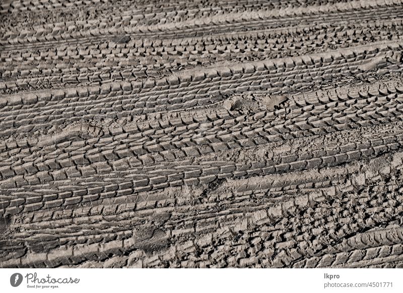 in the desert  beach track of car and truck like abstract background sand tracks tire dirt road texture wheel tyre pattern dune trace dry nature terrain vehicle