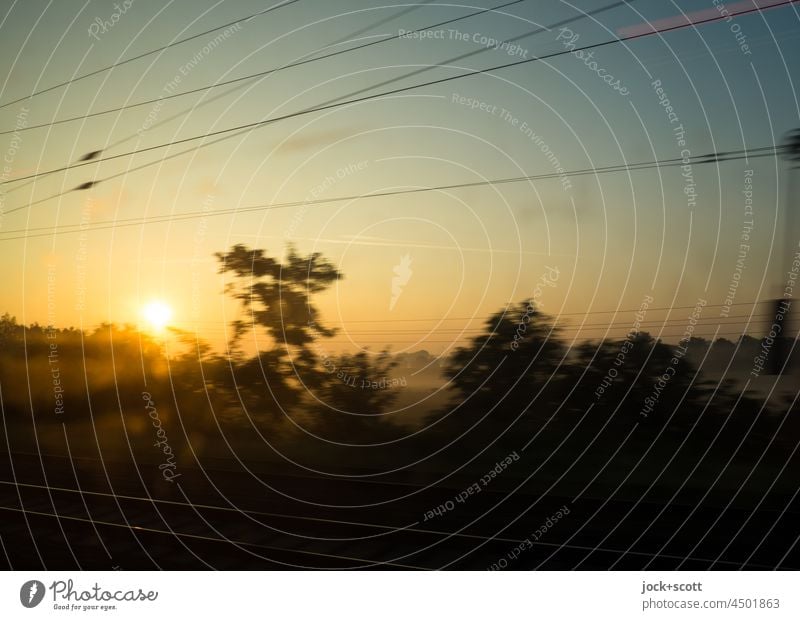 On the road in the early morning the sun rises Sunset Sky Twilight Railroad tracks country Overhead line motion blur Bushes Traffic infrastructure
