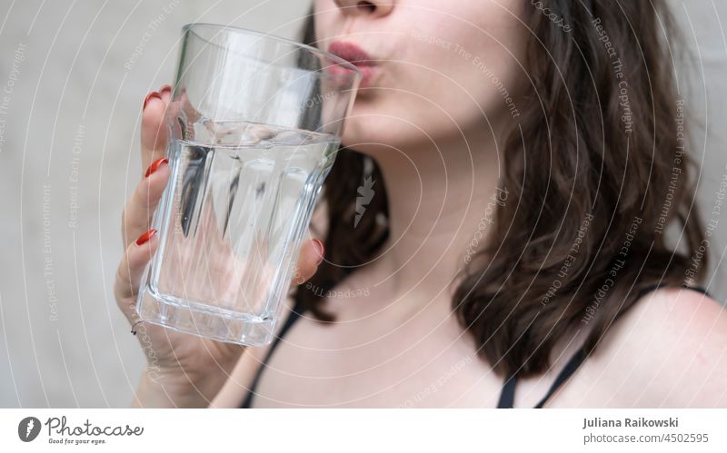 Woman drinks a large glass of water Water Drinking Glass Beverage Thirst Refreshment Cold Fluid Fresh Thirst-quencher Cold drink Drinking water Healthy