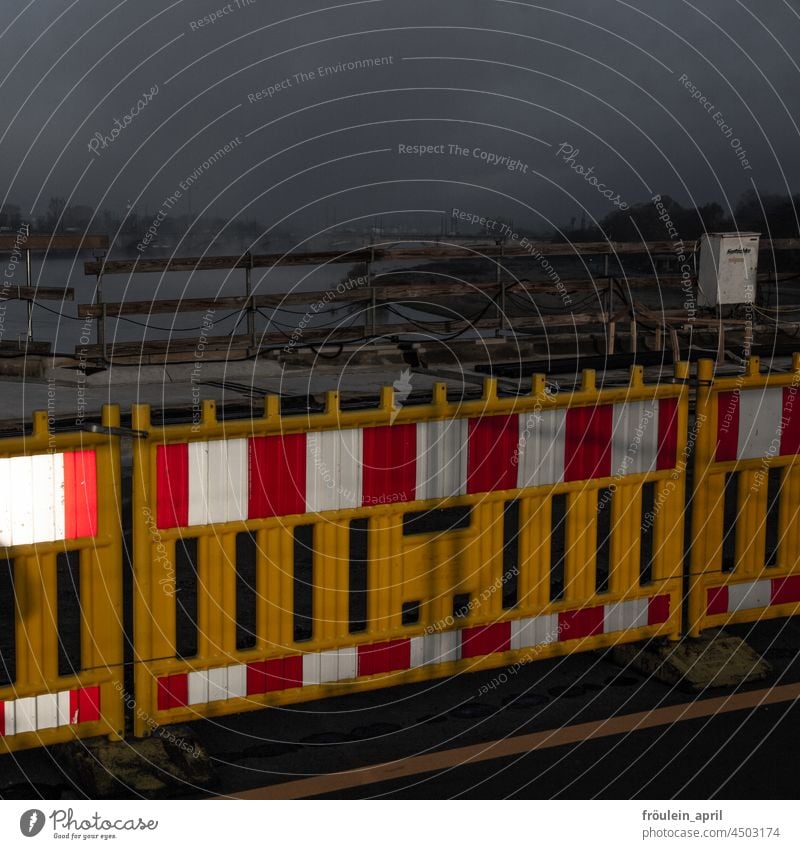 Demarcated - construction fence protects wooden fence Fence Construction site site fence Street Road construction Border Repair Barrier Safety cordon Hoarding