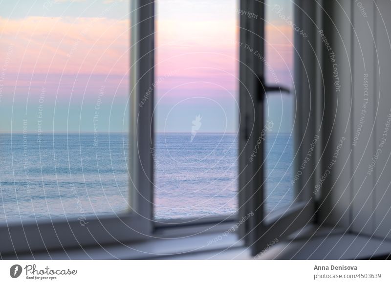 Sunrise over Atlantic Ocean through the open window ocean atlantic sunrise beach atlantic ocean wave porto pink house apartment morning portugal europe