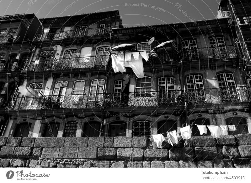 waving clotheslines on a balustrade of a southern house front Clotheslines Laundry House front Dry Hang Living or residing Photos of everyday life Washing day